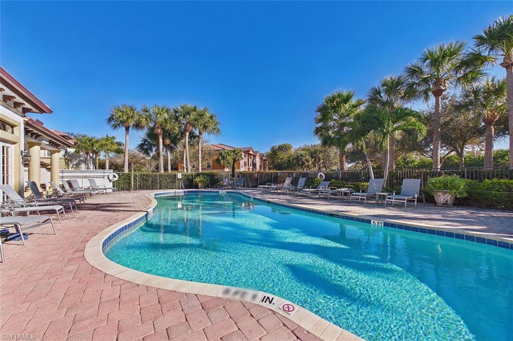 Community pool with a patio area