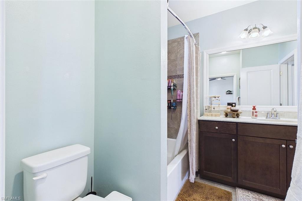 Full bath with vanity and shower / tub combo with curtain