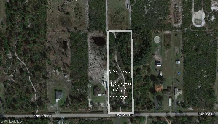 Aerial overview of property's location featuring property parcel outlined