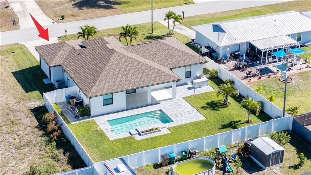 View of subject property with a pool area