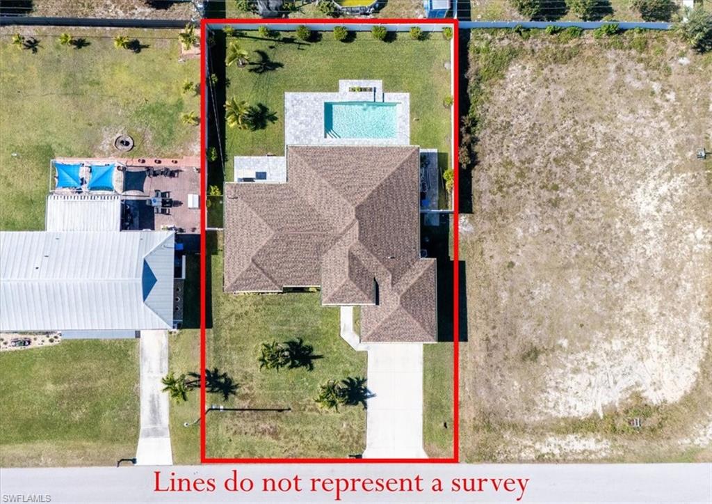 Aerial view of property and surrounding area with property boundaries highlighted