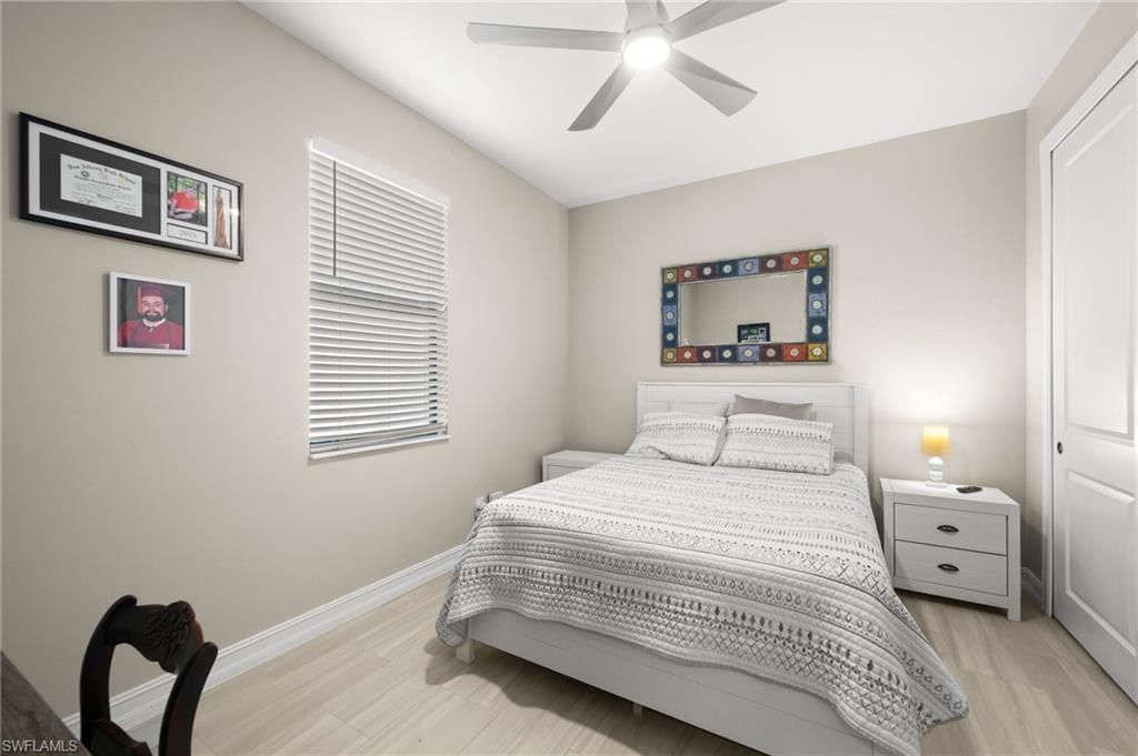 Bedroom featuring a ceiling fan and light wood-type flooring