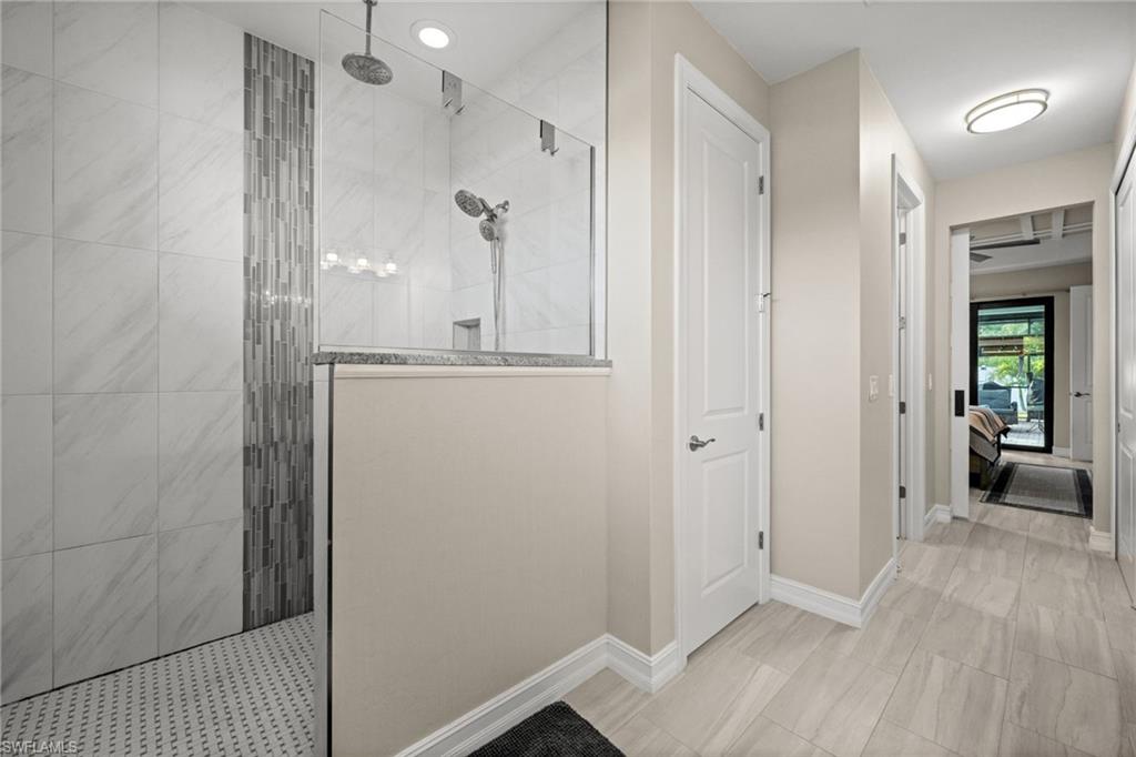 Ensuite bathroom featuring walk in shower
