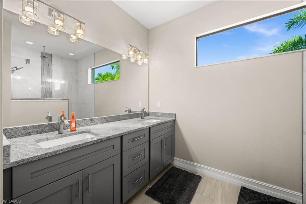 Full bath with double vanity and walk in shower