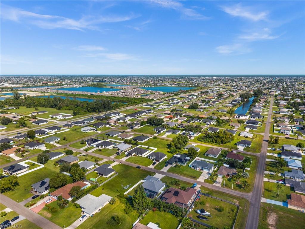 Aerial view of residential area with a nearby body of water