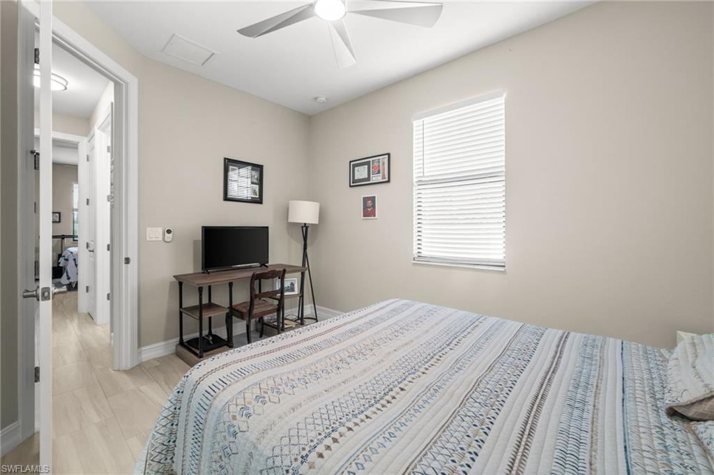 Bedroom featuring baseboards and ceiling fan