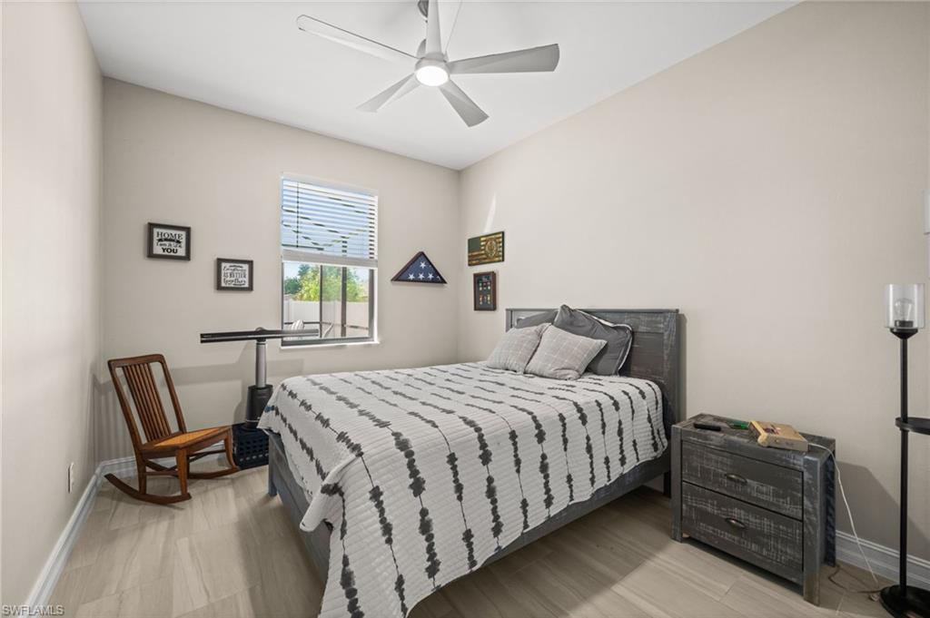 Bedroom featuring light wood-style floors and a ceiling fan