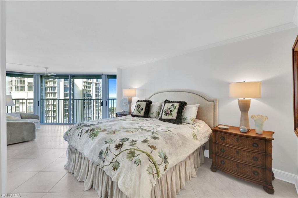 Bedroom featuring crown molding, floor to ceiling windows, access to exterior, and light tile patterned floors