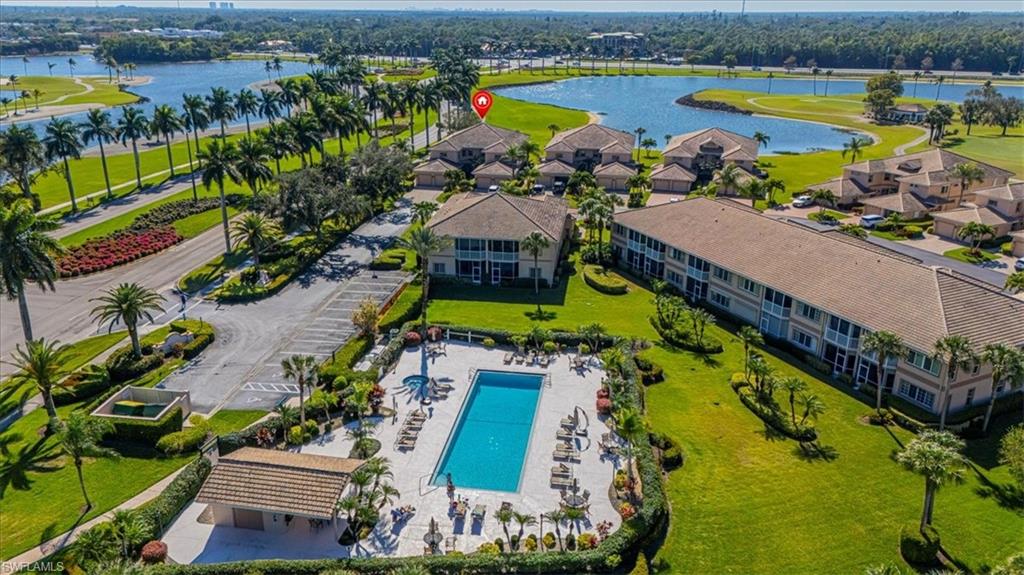 Aerial view of a nearby body of water and a pool area