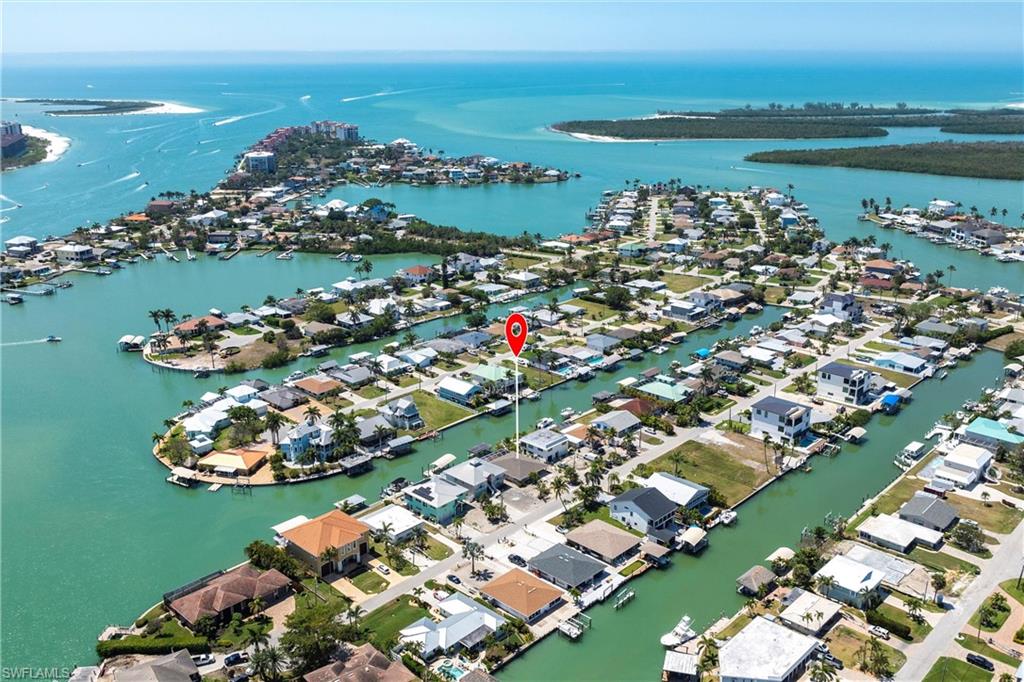 Birds eye view of property featuring a residential view and a water view