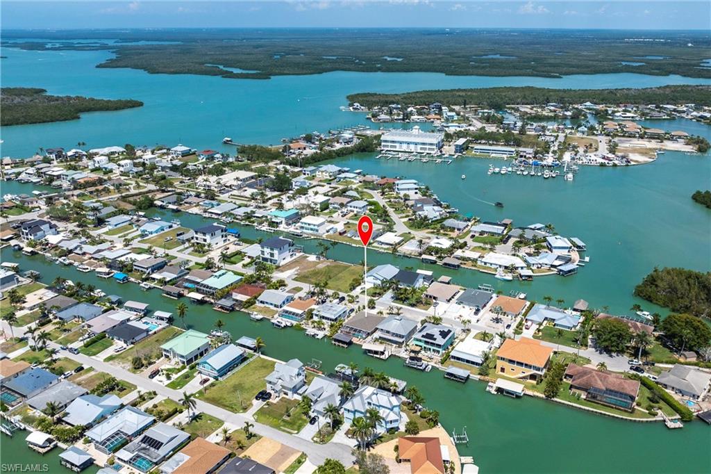 Aerial view with a residential view and a water view