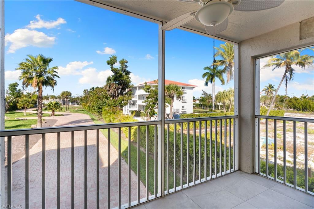 Balcony featuring ceiling fan and a sunroom