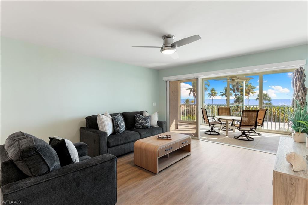 Living area featuring wood finished floors and ceiling fan