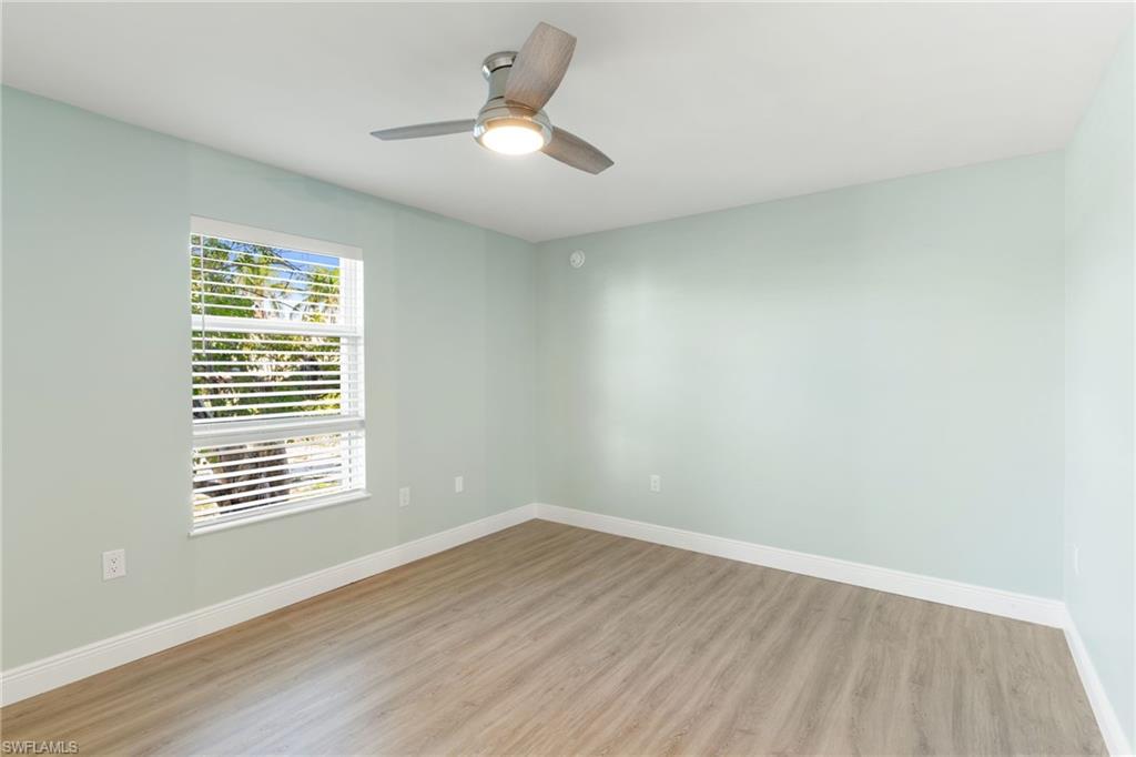 Bedroom featuring light wood-type flooring and ceiling fan