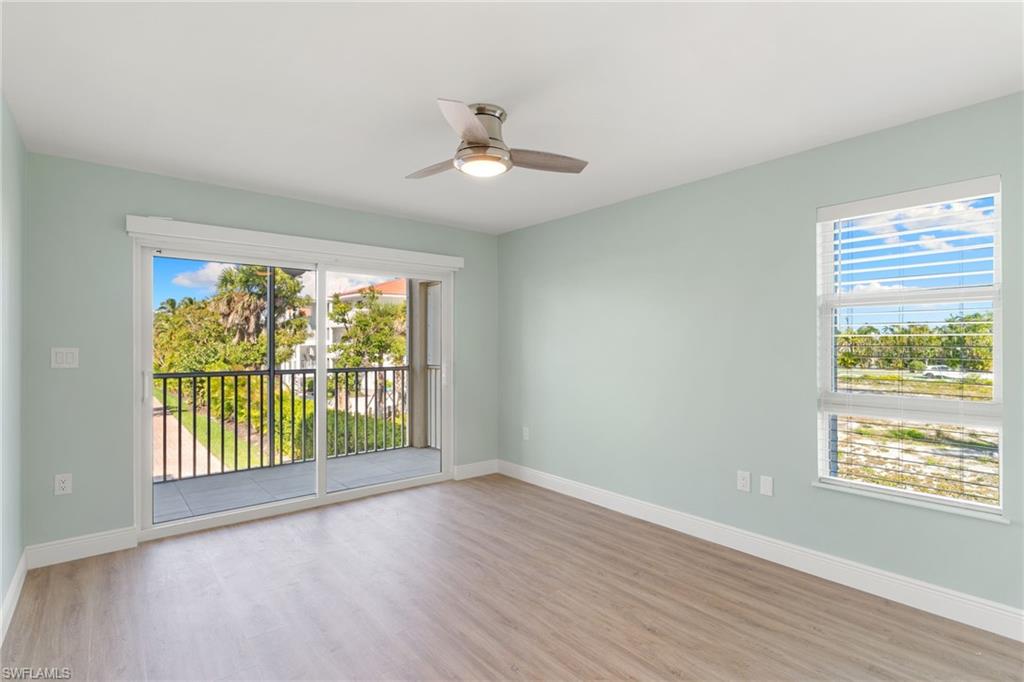 Bedroom with light wood-type flooring and a ceiling fan