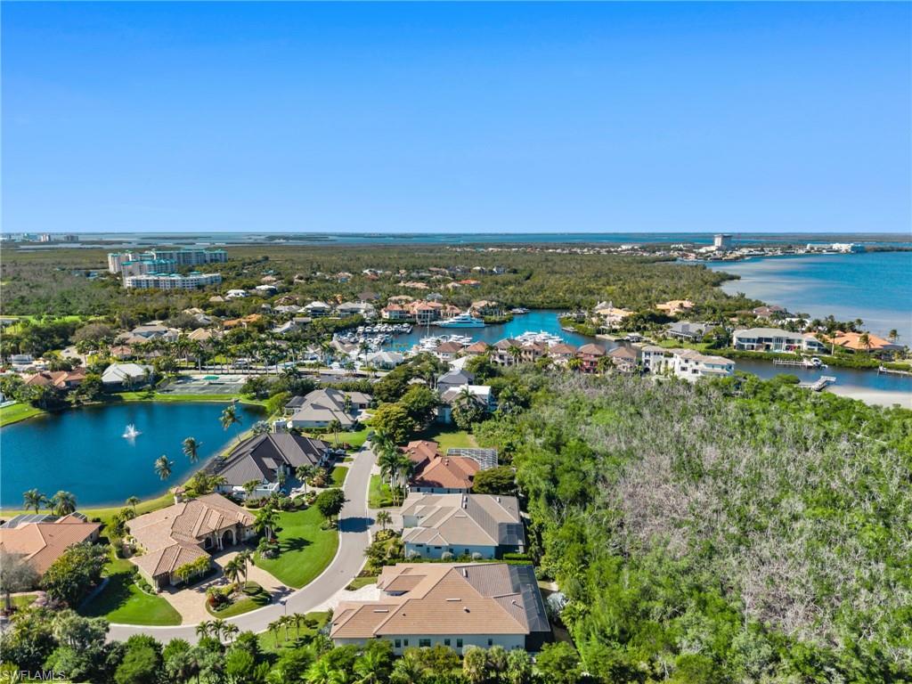 Aerial perspective of suburban area featuring a large body of water
