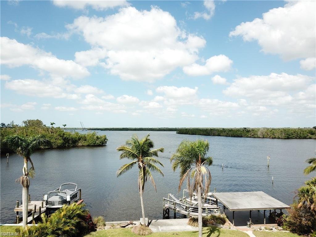 Water view with a boat dock and boat lift