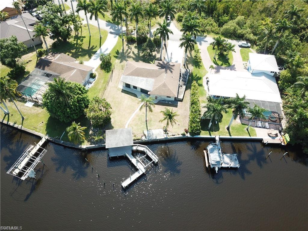 View of property location featuring a nearby body of water and nearby suburban area