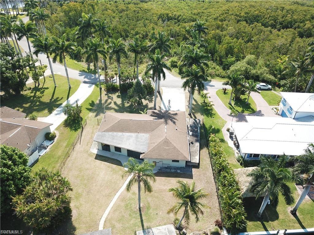View from above of property featuring a heavily wooded area