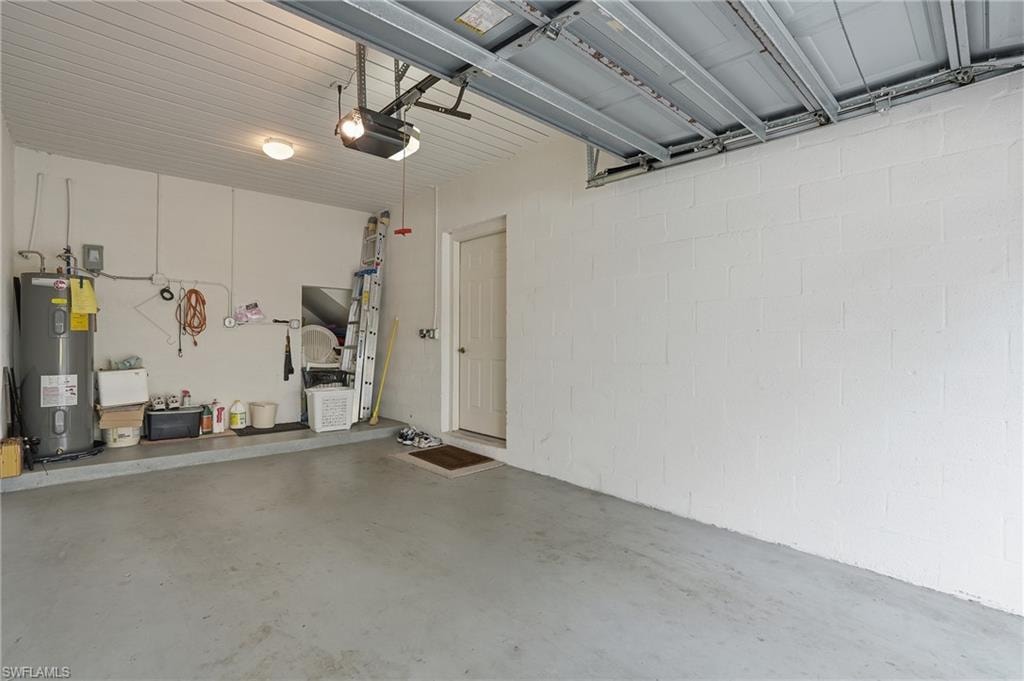 Garage featuring electric water heater