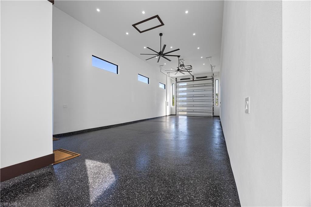 RV Garage featuring recessed lighting and a ceiling fan