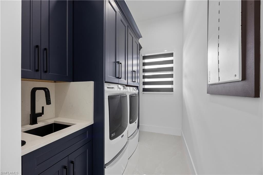 Laundry area with washer and dryer and cabinet space