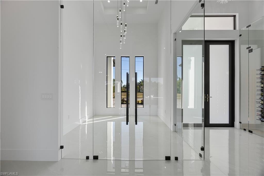 Foyer entrance featuring a high ceiling