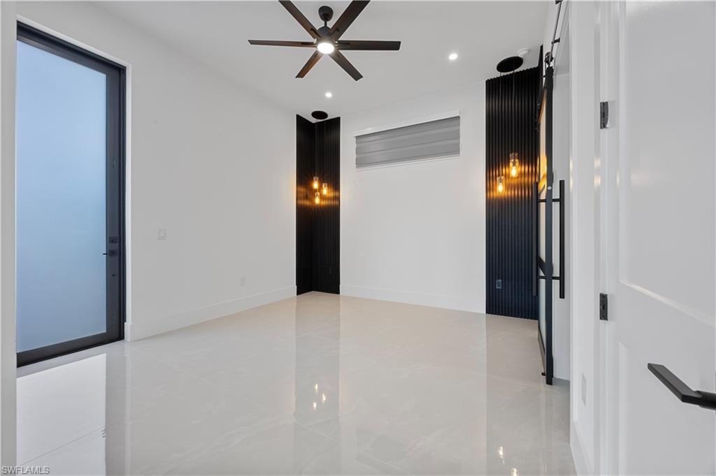 Mother in Law Primary room with a ceiling fan and recessed lighting