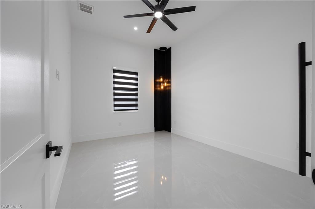 Unfurnished room with a ceiling fan and recessed lighting