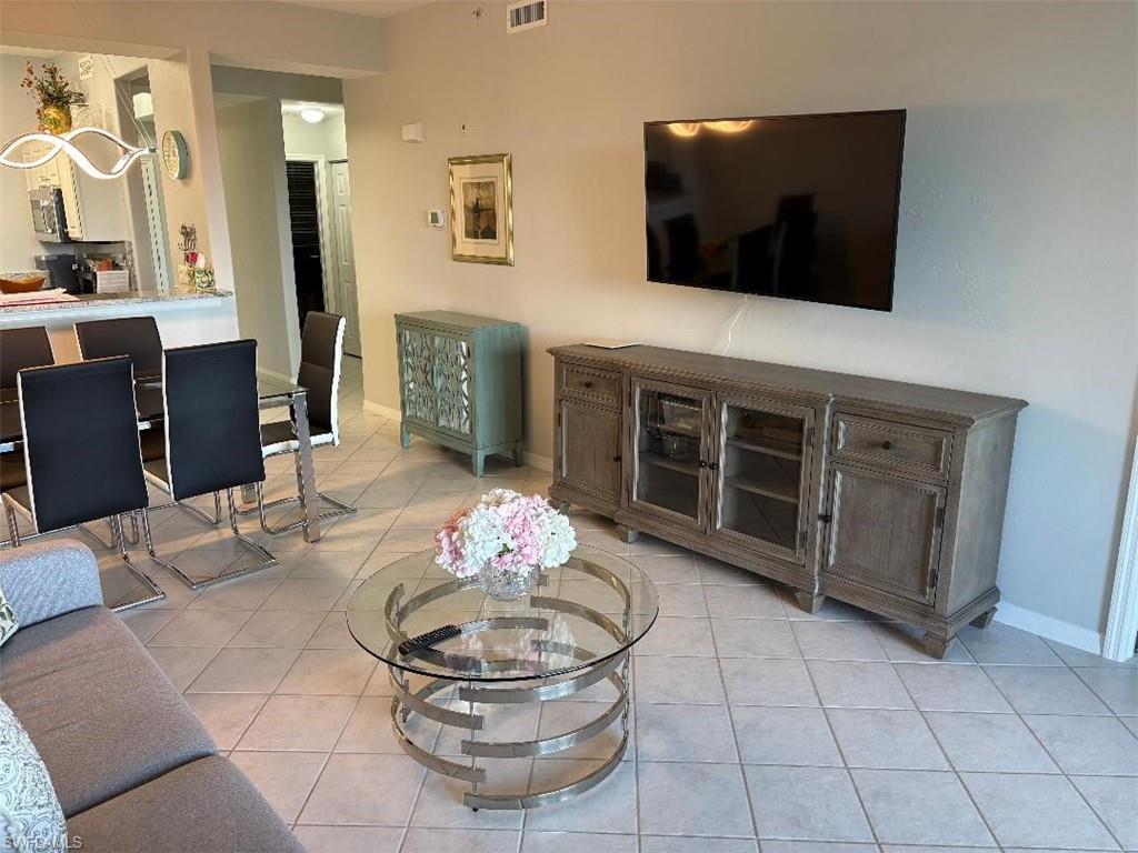 Living area with wall mounted television.