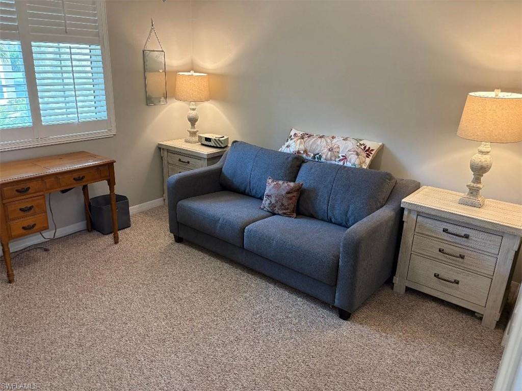 Guest bedroom also serves as sewing room with hide-a-bed.