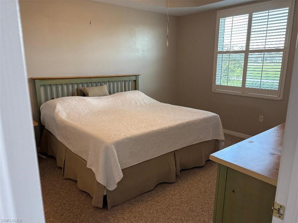 View of carpeted bedroom.