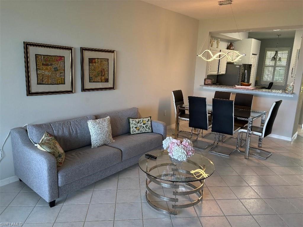 Living area featuring light tile patterned flooring