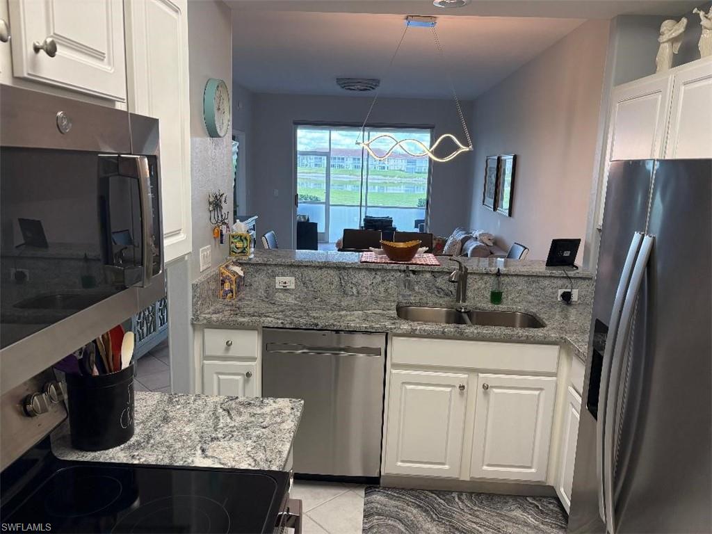 Kitchen with stainless steel appliances.