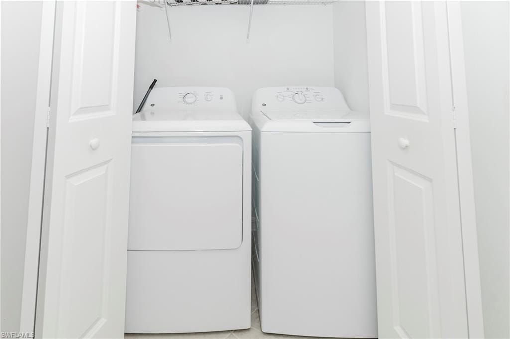 Laundry area featuring independent washer and dryer