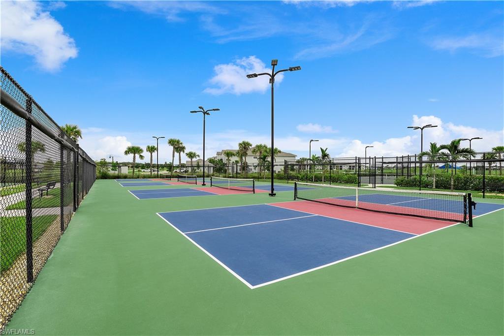 View of tennis court featuring community basketball court
