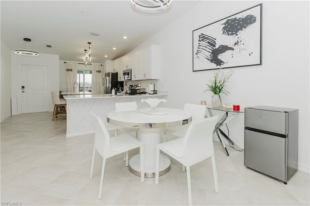 Dining area with baseboards and recessed lighting