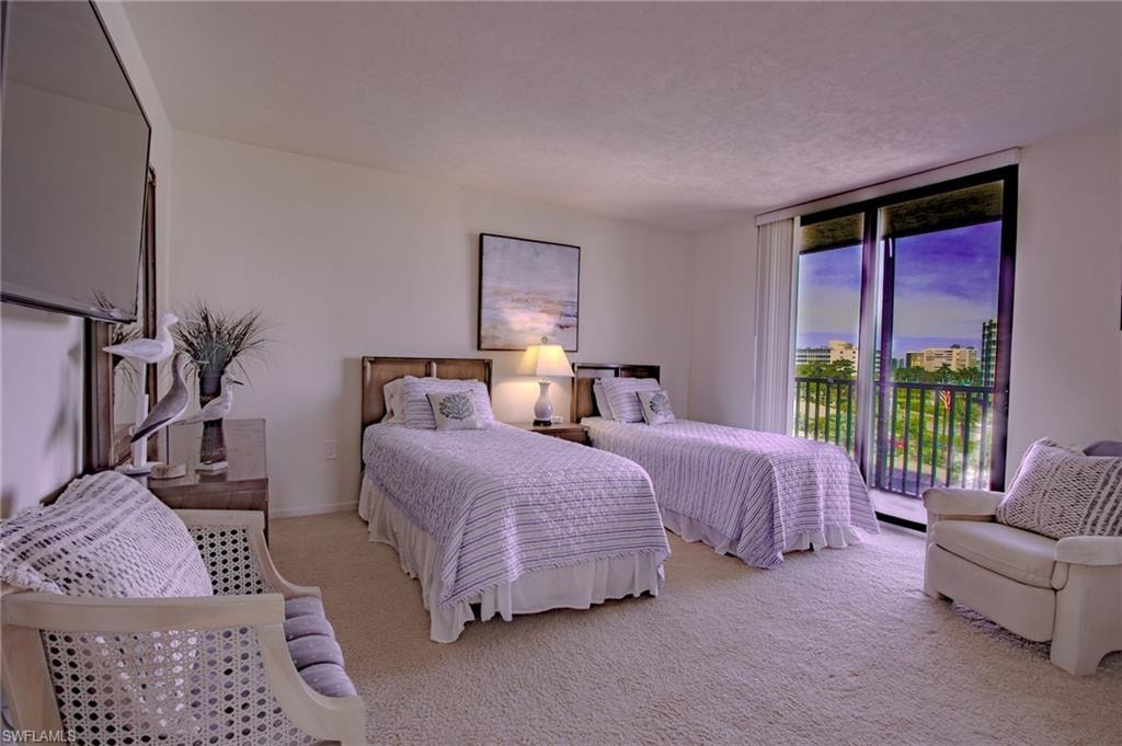 Twin bedroom with patio.  Bright and cheerful bedrooms ready to welcome guests.