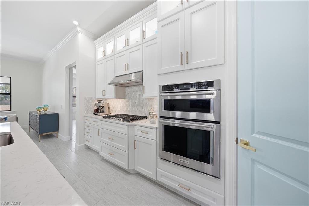 Updated kitchen with freshly painted cabinetry and modern finishes