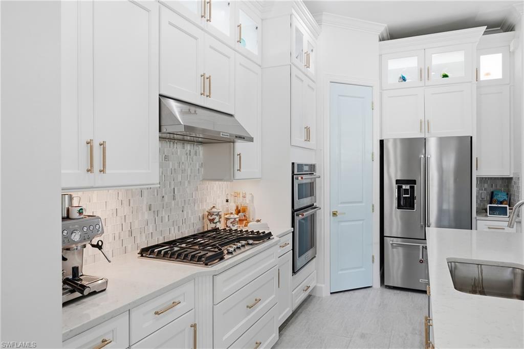 Updated kitchen with freshly painted cabinetry and modern finishes