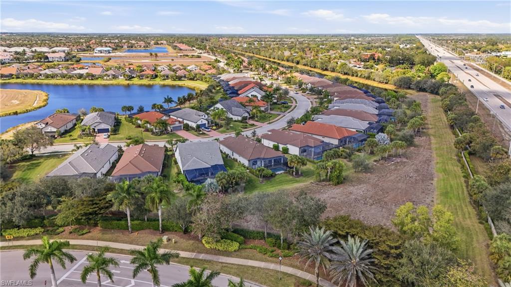 Drone view highlighting the home’s position on the lot and surrounding greenery.