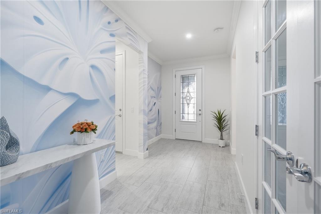 Welcoming interior entry with freshly painted walls, updated lighting, and a bright, open feel that sets the tone for the home’s refreshed interior. Clean architectural lines create an inviting first impression upon entry.
