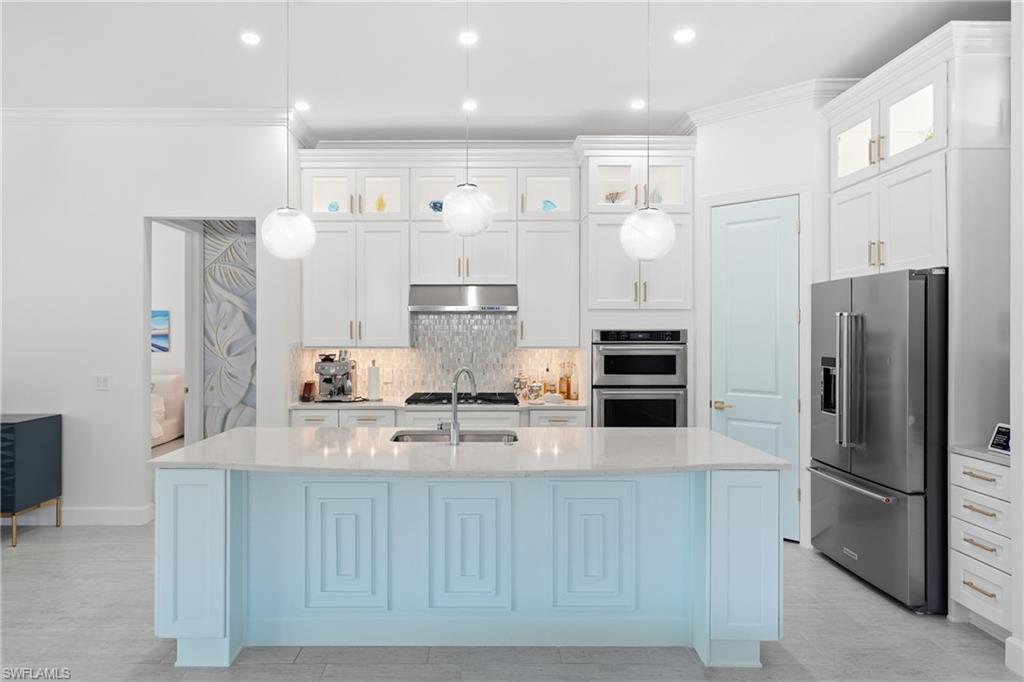 Updated kitchen with freshly painted cabinetry and modern finishes
