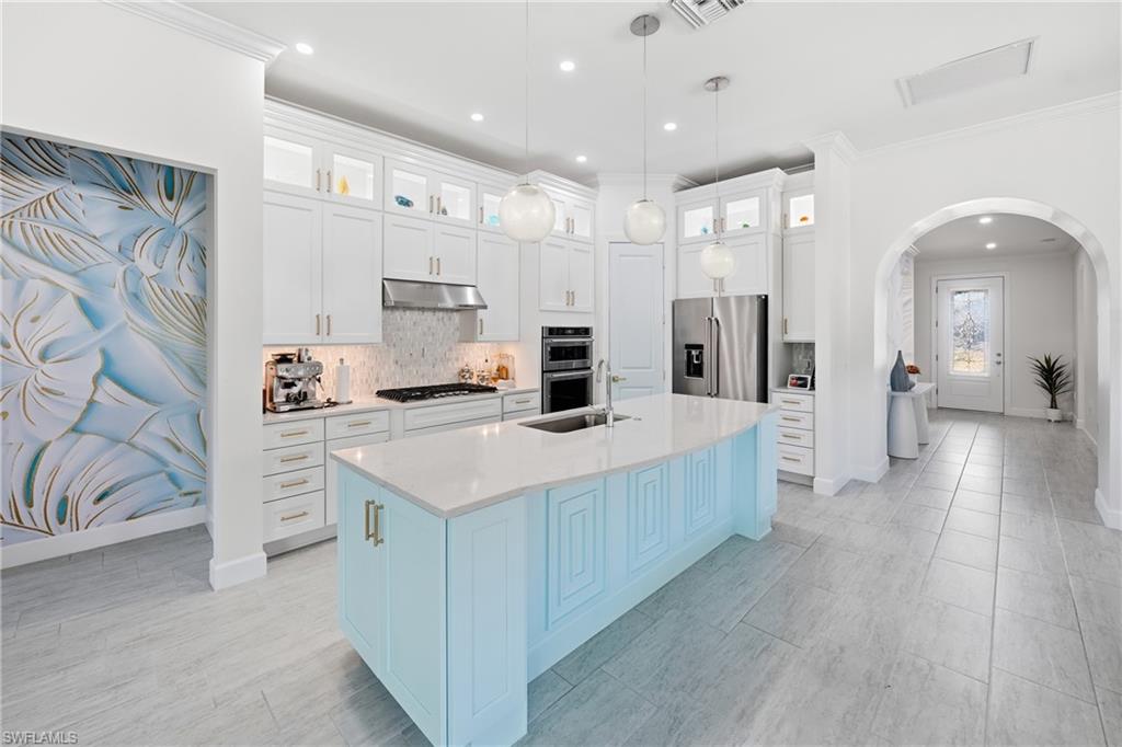 Oversized kitchen island with refreshed finish and bar seating
