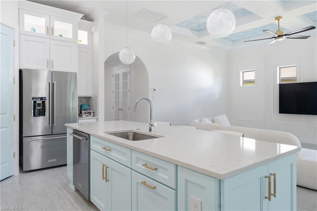 Updated kitchen with freshly painted cabinetry and modern finishes