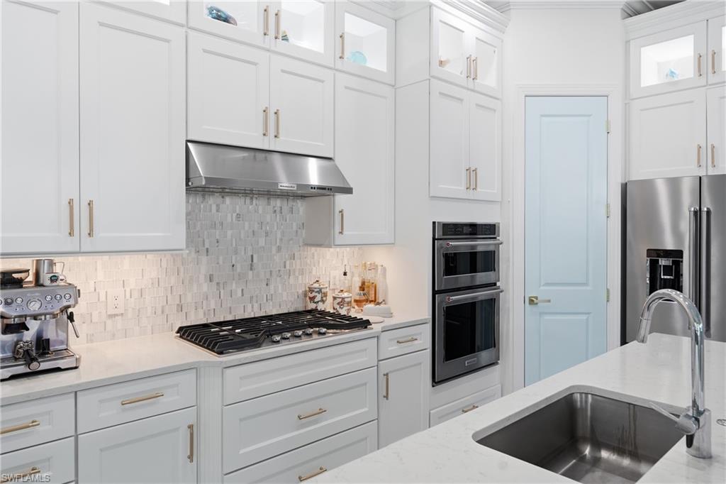 Updated kitchen with freshly painted cabinetry and modern finishes