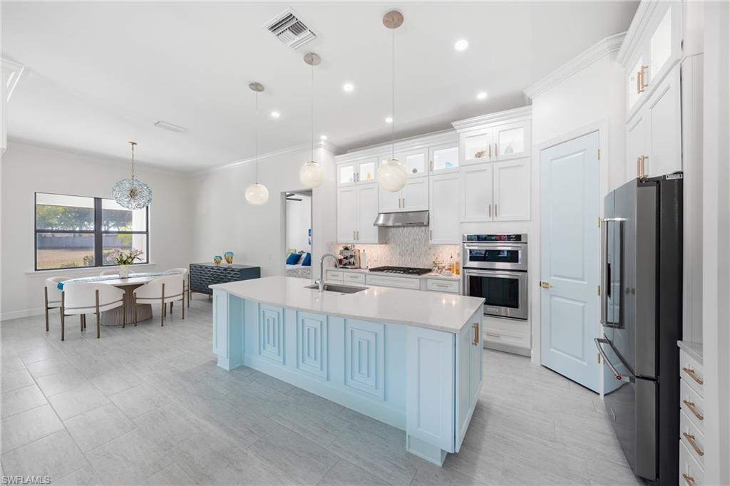 Updated kitchen with freshly painted cabinetry and modern finishes