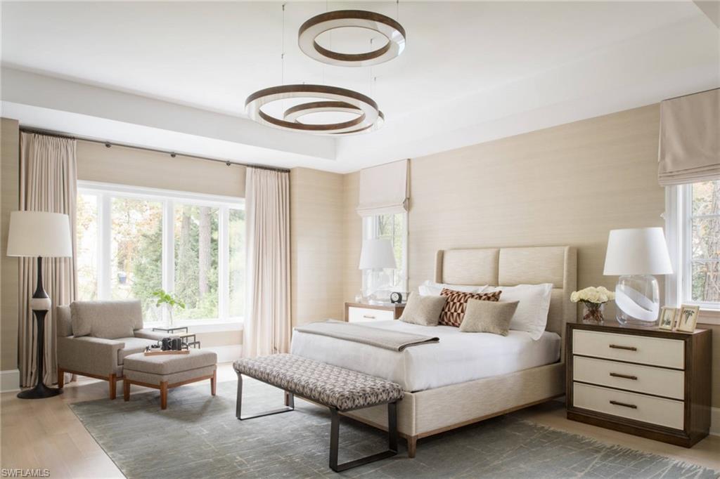 Photos are of a similar home by builder and are for illustrative purposes only. Bedroom featuring light wood-style flooring and baseboards.