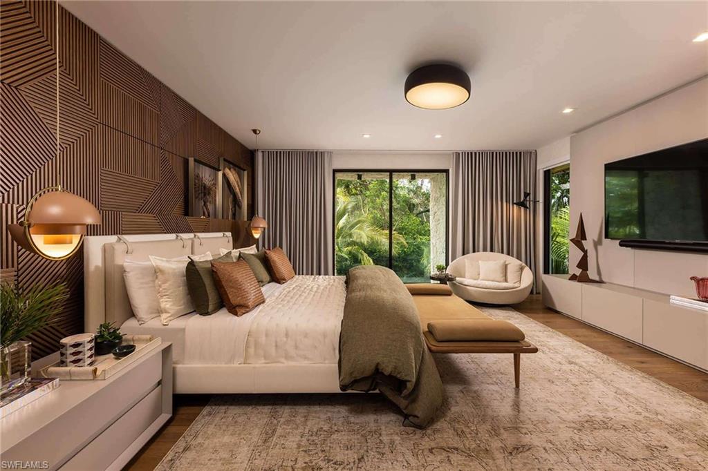 Photos are of a similar home by builder and are for illustrative purposes only. Bedroom with wood finished floors and recessed lighting.
