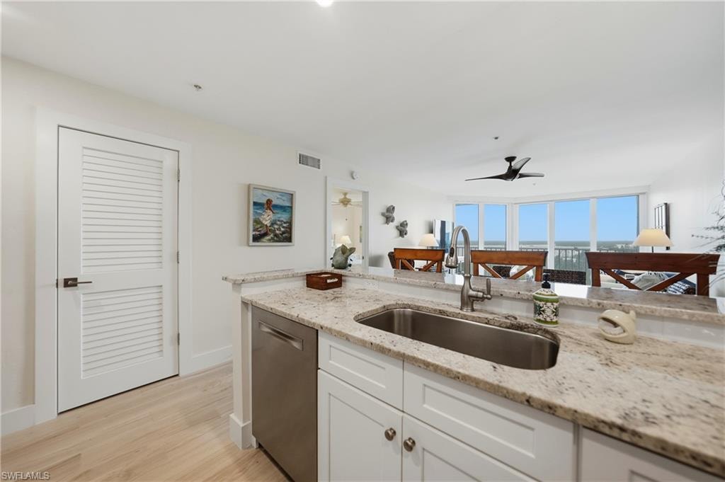 Open Kitchen with Wood Cabinets, Under Cabinet Lighting, Breakfast Bar and Stainless Appliances, Pantry, Tile Flooring